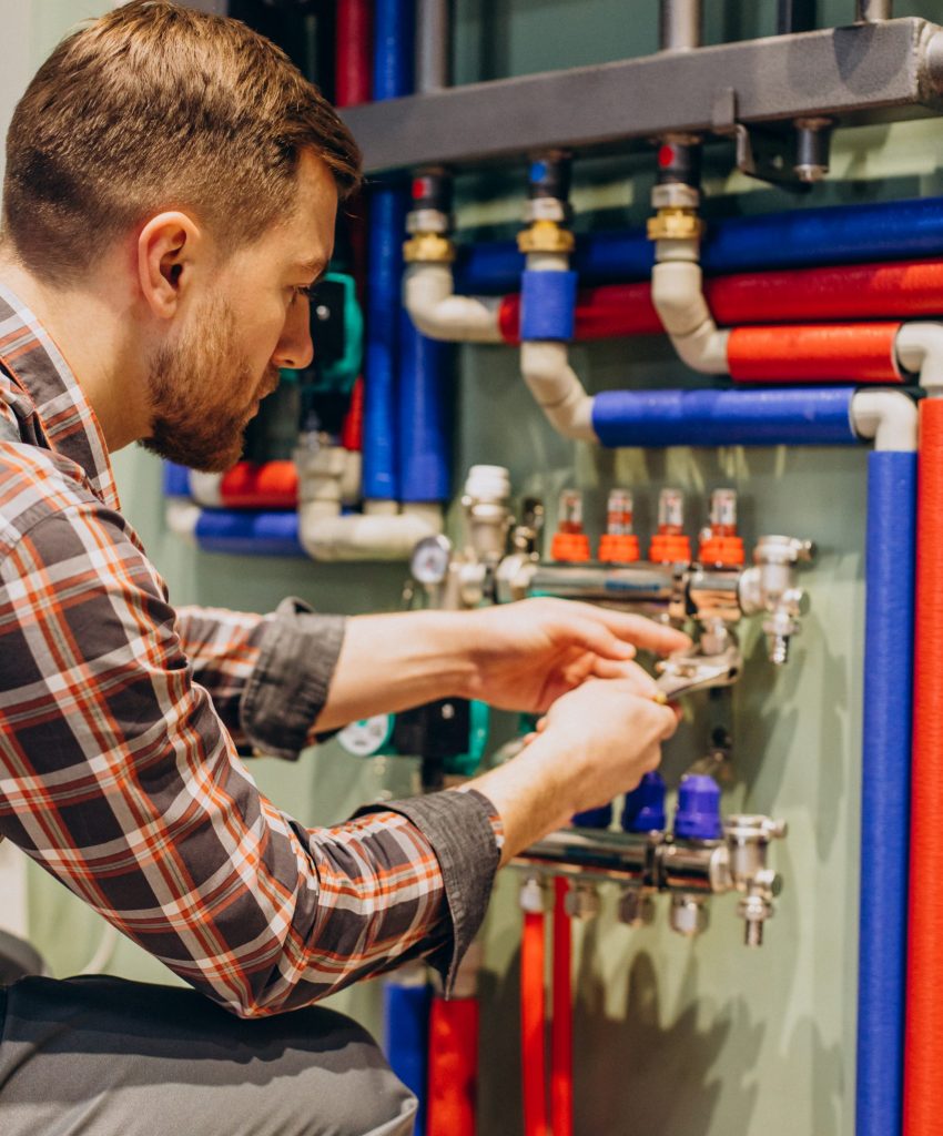 Young engineer adjusting autonomous heating